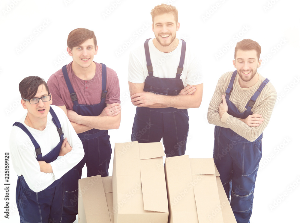 Happy smiling movers carrying boxes, isolated on white backgroun Happy smiling movers carrying boxes, isolated on white backgroun