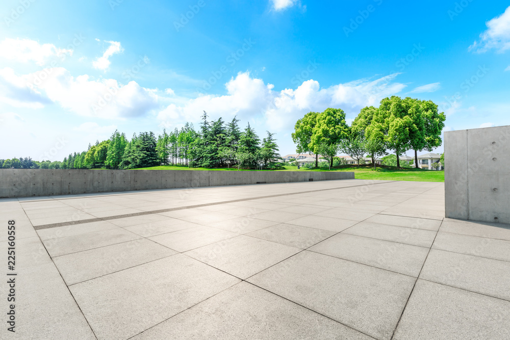 Empty square floor and green forest natural scenery in the city park
