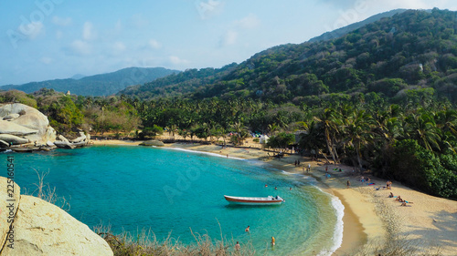 tropical beach with turquoise water at tayrona natural park photo