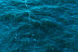 Sea background, water texture - water with small waves, top view