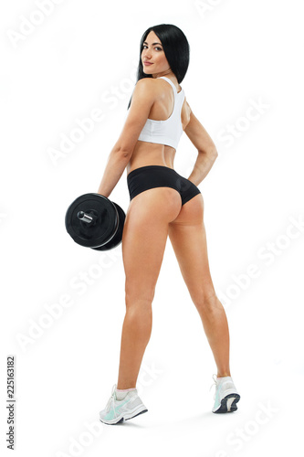 Fitness woman athlete and bodybuilder holding dumbbell . Isolated on white background.
