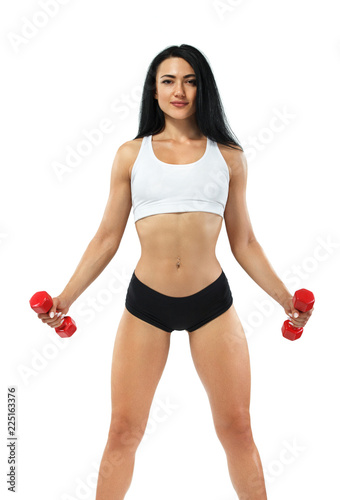 Fitness woman athlete and bodybuilder holding dumbbell . Isolated on white background.