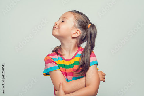 Принти на полотні offended beautiful cute little girl turning her head to side