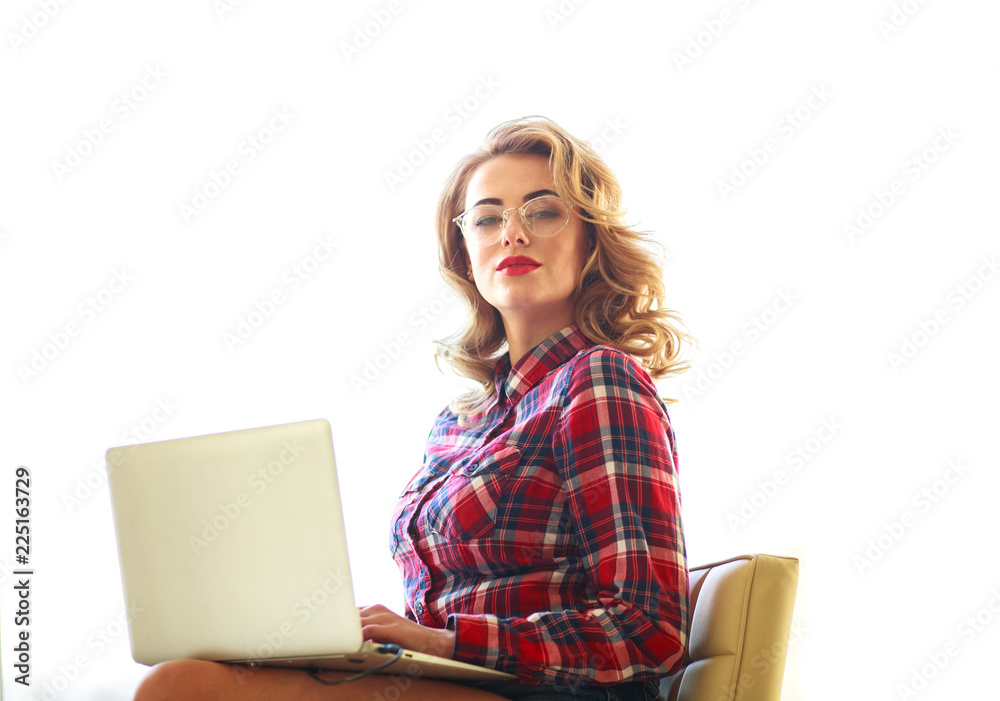 Beautiful young woman working with laptop on white background Beautiful young woman working with laptop on white background