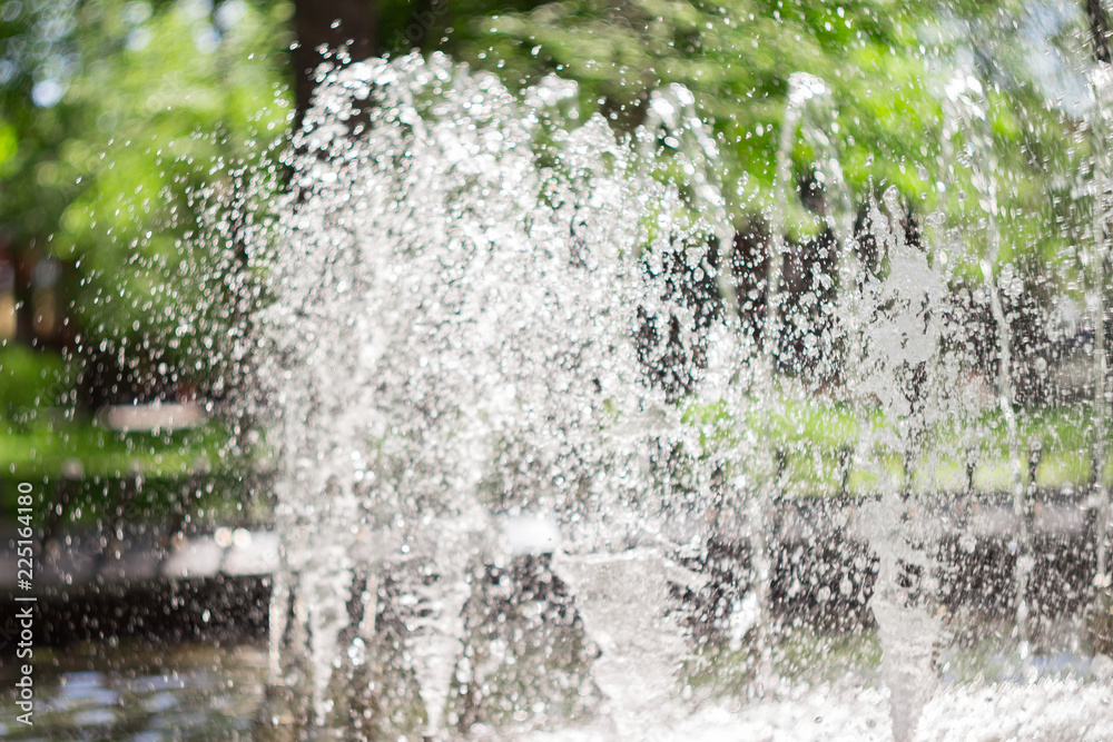 Splash of fountain in the spring or summer park. Water splash Splash of fountain in the spring or summer park. Water splash