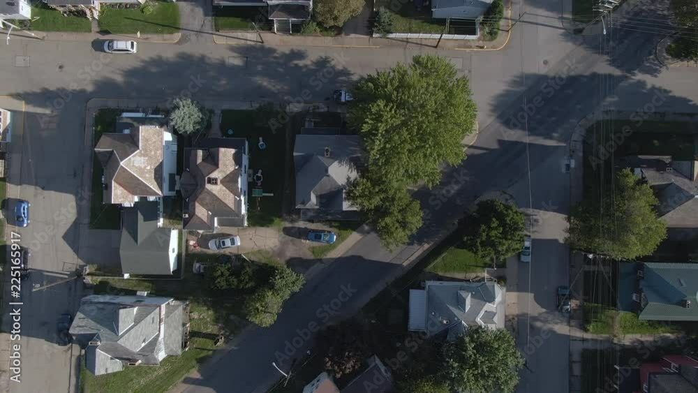 A top down bird's eye aerial flyover view of a typical western Pennsylvania residential neighborhood. Pittsburgh suburbs. A top down bird's eye aerial flyover view of a typical western Pennsylvania residential neighborhood. Pittsburgh suburbs.