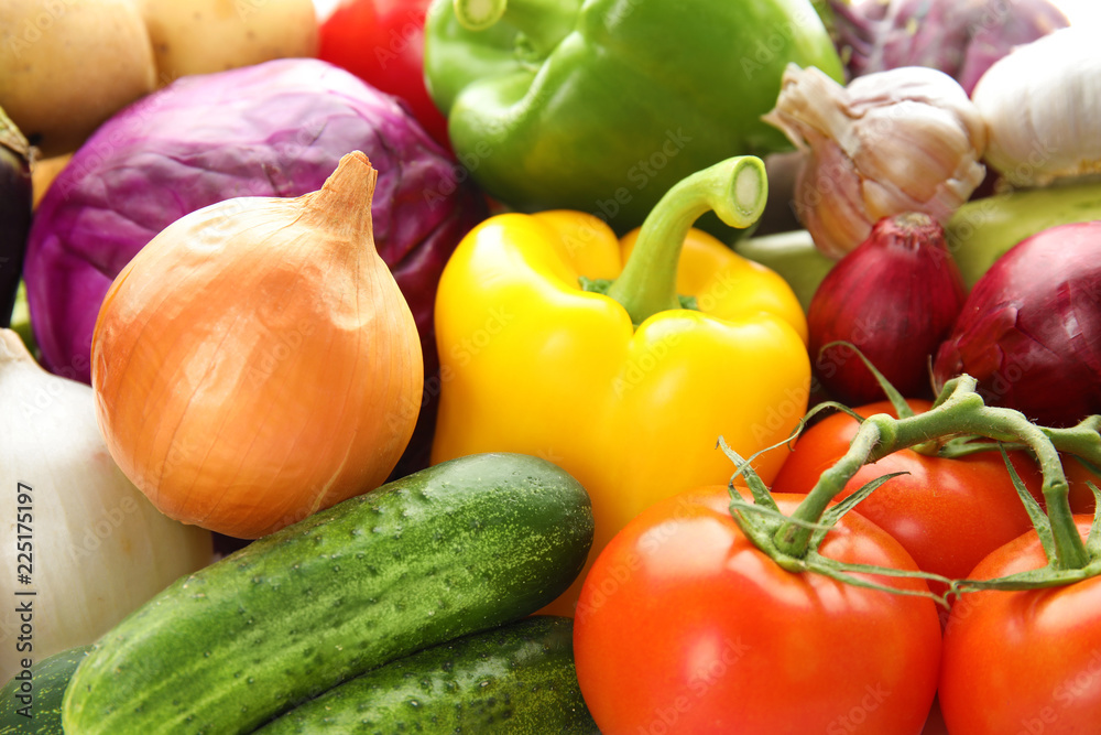Many fresh ripe vegetables as background. Organic food