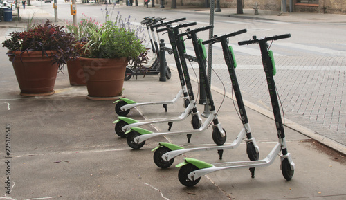 Photography Dockless Electric Scooters on the Sidewalk