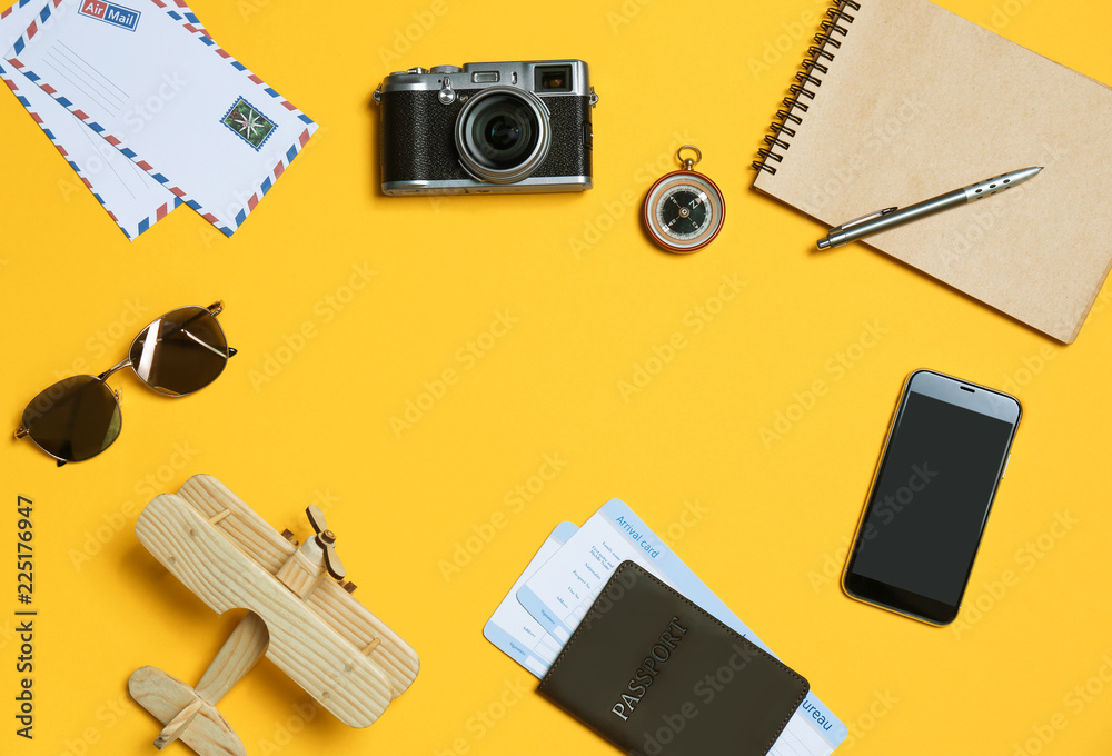 Flat lay composition with camera, passport and space for text on color background. Professional photography