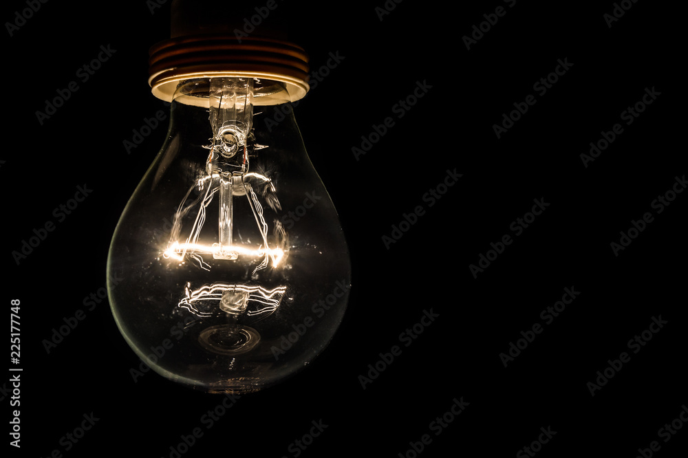 Light bulb on a black background Light bulb on a black background