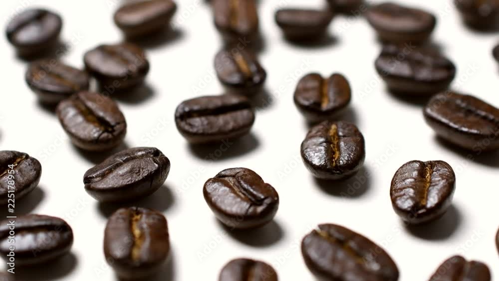 Rotating of coffee beans on white background Rotating of coffee beans on white background