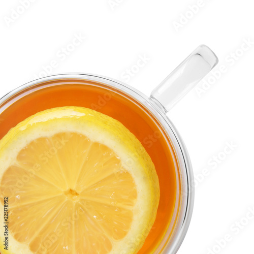 Glass cup with hot tea and lemon on white background, top view. Space for text