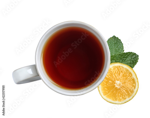 Cup of tea, mint and lemon on white background, top view