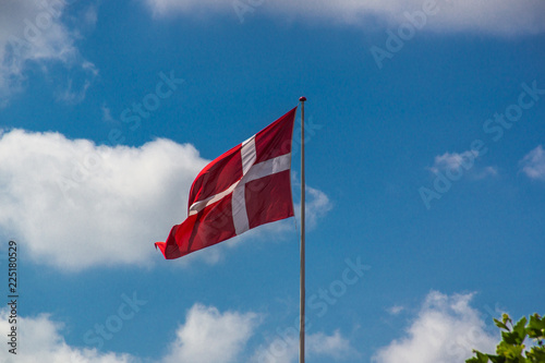 Danish flag on a sunny day with a clear blue sky