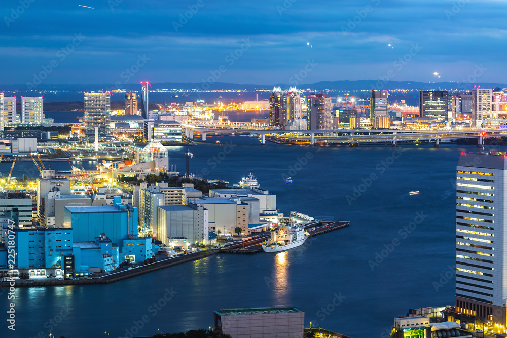 View of boats on the busy Tokyo Bay harbor at twilight
