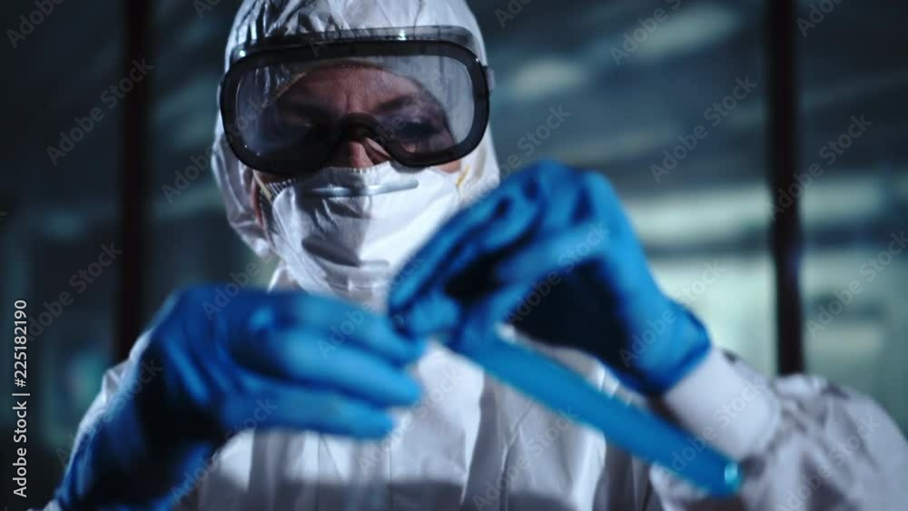 Laboratory technician studies samples. Test tube, chemist, working in the laboratory Laboratory technician studies samples. Test tube, chemist, working in the laboratory