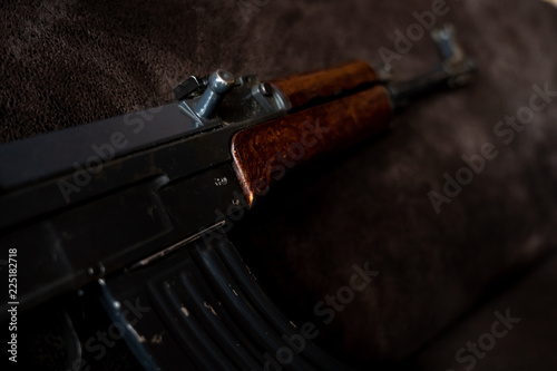 Low key photo of AK-47 Kalashnikov rifle. Dark themed automatic rifle from Russia/Soviet union.