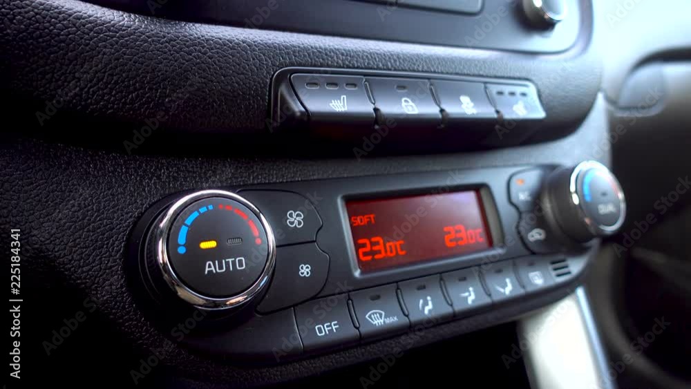 Man press the climate control button and adjusts the temperature in the car. 4K Man press the climate control button and adjusts the temperature in the car. 4K