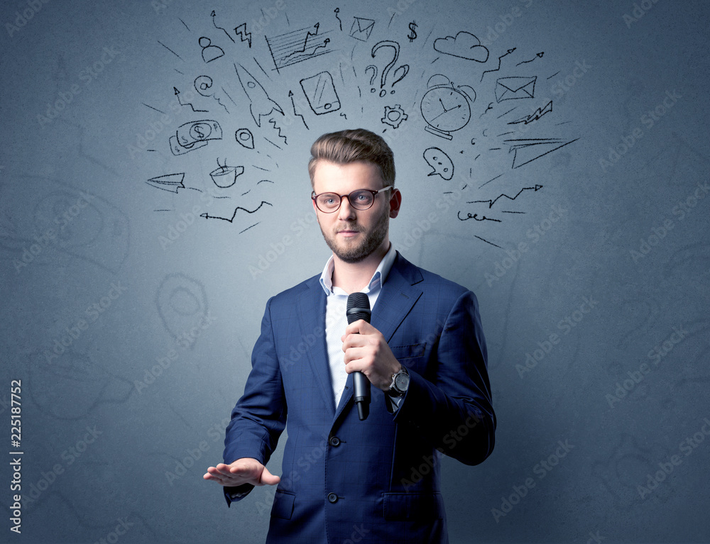Businessman speaking into microphone with mixed doodles over his head Businessman speaking into microphone with mixed doodles over his head