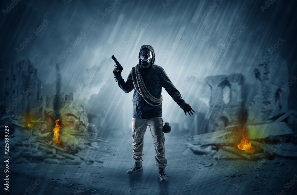 Destroyed place after a catastrophe with man in gas mask and weapon on his hand
Destroyed place after a catastrophe with man in gas mask and weapon on his hand
