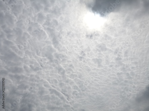 The Sun on Cloudy grey sky