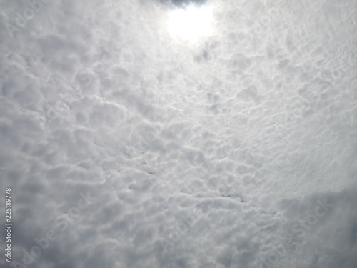 The Sun on Cloudy grey sky
