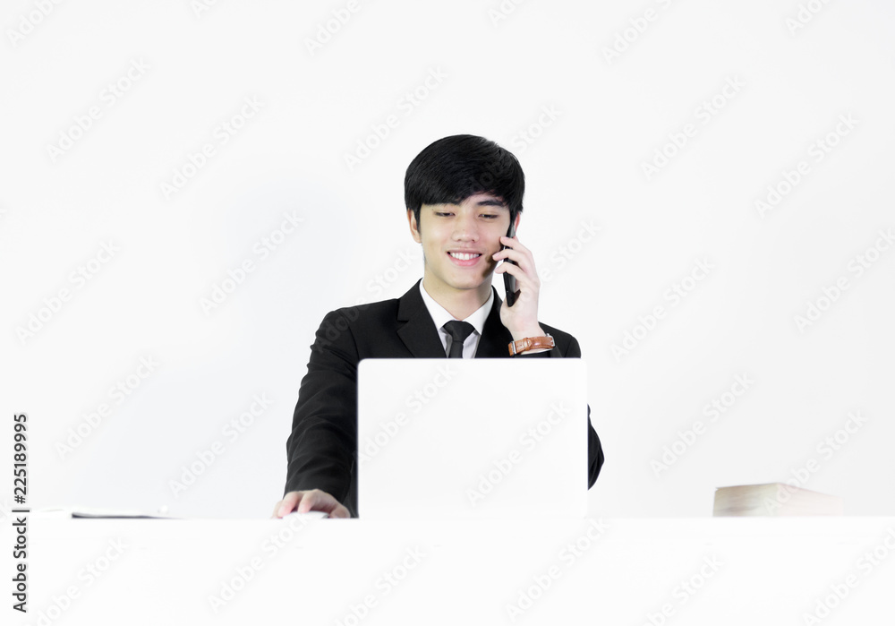 Asian manager businessman sitting at desk and working, isolated on white background. Asian manager businessman sitting at desk and working, isolated on white background.