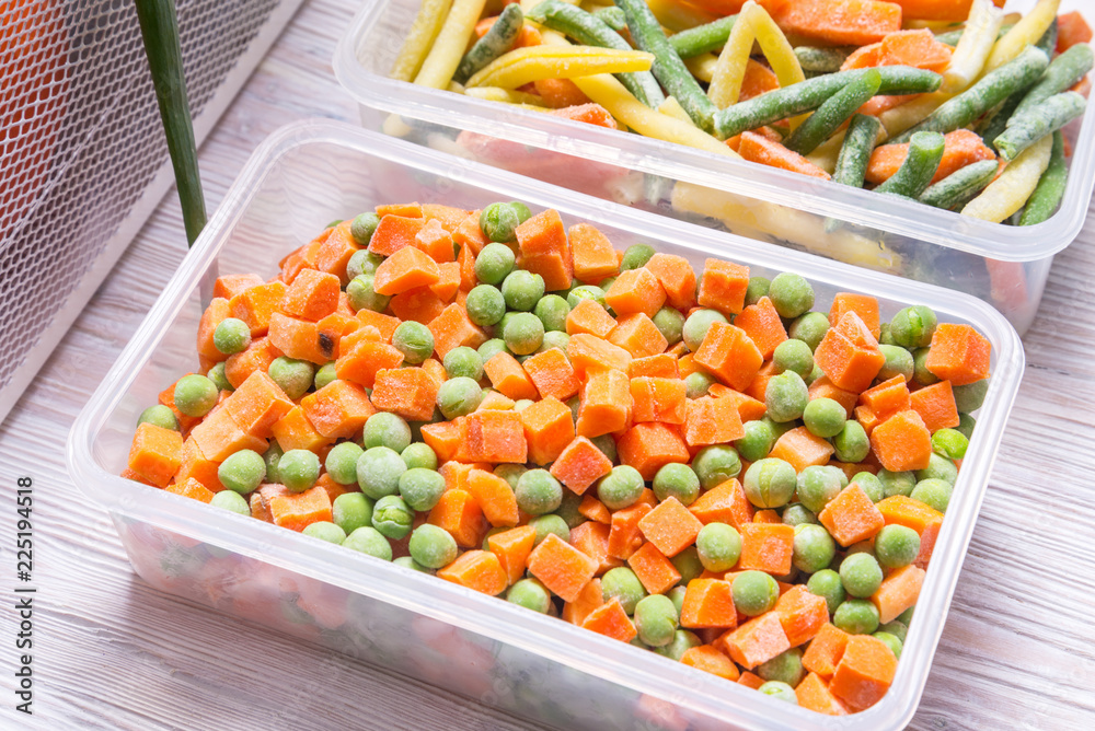 Plastic storage boxes with frozen vegetables