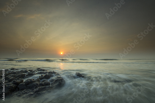 Glorious morning sunrise at Pantai Batu Hitam  Batu Hitam Beach   Kuantan  Pahang. Awesome clouds with ray of light visible.