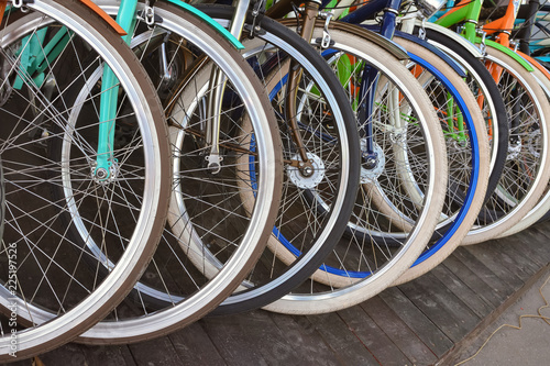 row of bicycle wheels, bicycle wheels
