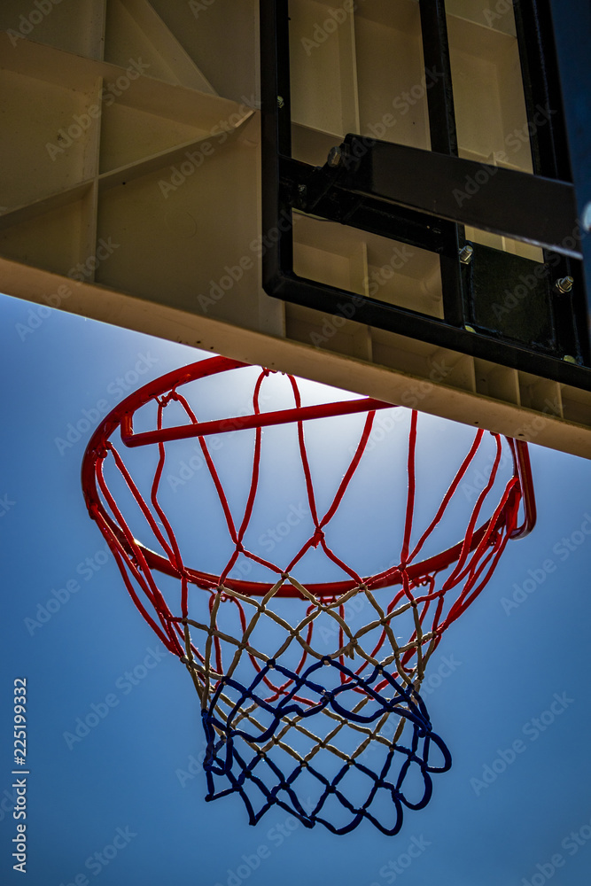 outdoor basketball game, with basket close-up