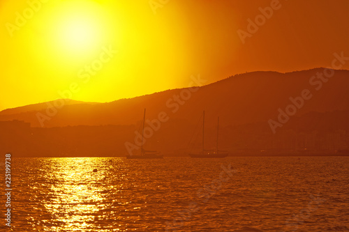 Sailing yachts in golden haze at sunset © artesiawells