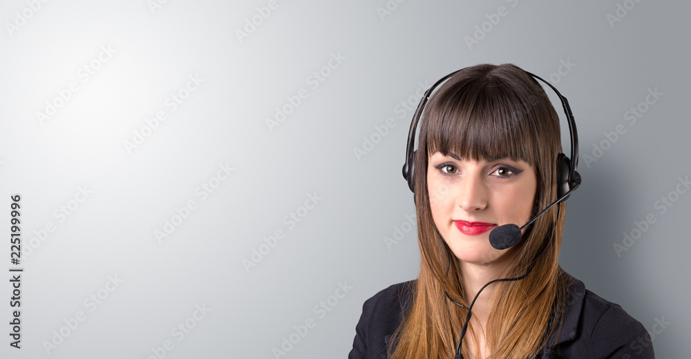 Young female telemarketer on a white background Young female telemarketer on a white background