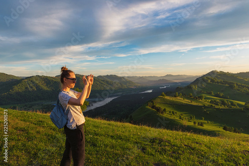 Woman taking photo on mobil...