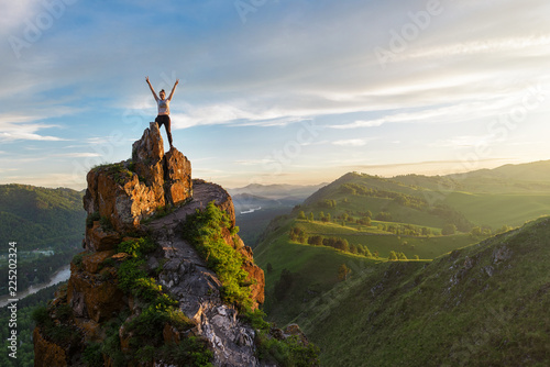 Woman on top mountain in Al...