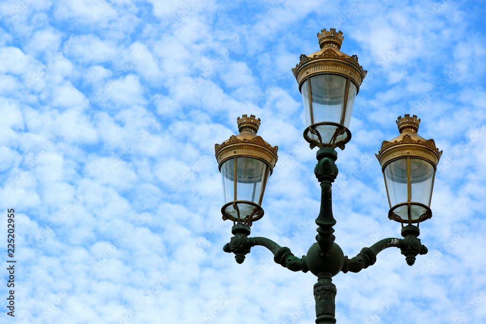 Gorgeous vintage style street lamps of the Historical Centre of Cusco against cloudy blue sky, Cusco, Peru 