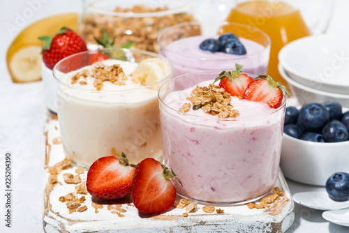 sweet yoghurts with fruits and berries for breakfast