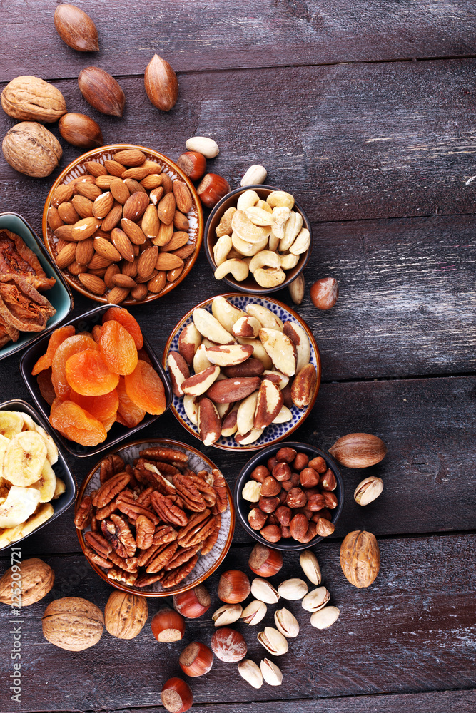 dried fruits and assorted nuts composition on rustic table dried fruits and assorted nuts composition on rustic table