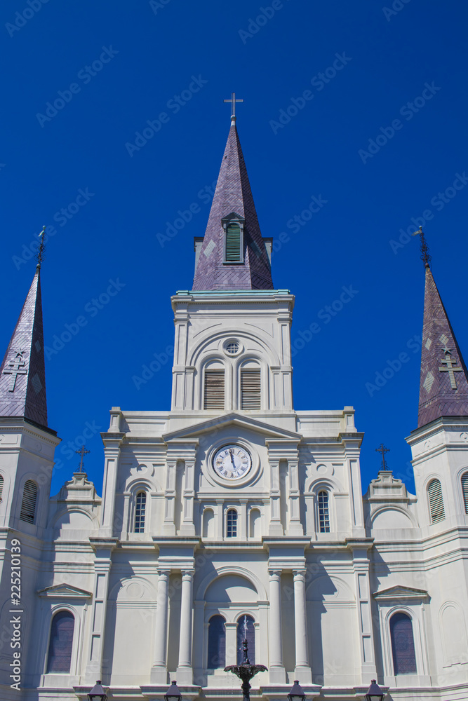The Front Entry of the Saint Louis Cathedral with a Fountain in the Foreground in Jackson Square in the French Quarter of New Orleans, Louisiana, USA