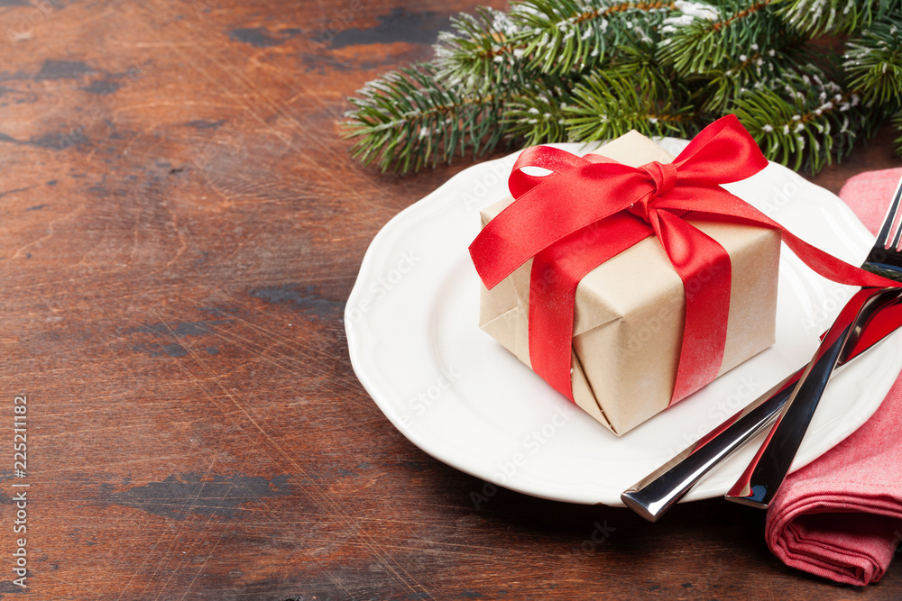 Christmas table setting with gift box and xmas tree Christmas table setting with gift box and xmas tree
