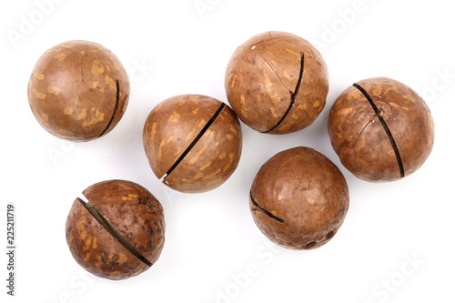 unshelled macadamia nuts isolated on white background. Top view. Flat lay pattern