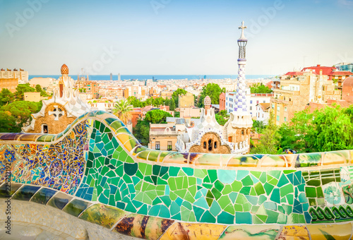 Gaudi bench and cityscape of Barcelona from park Guell, famous view of Barcelona, Spain, toned