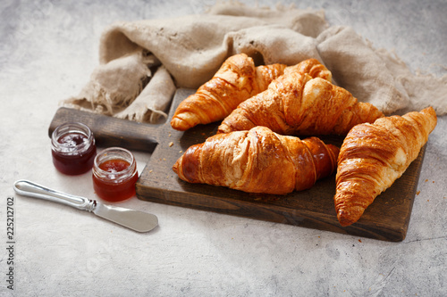 fresh croissants with fruits jam