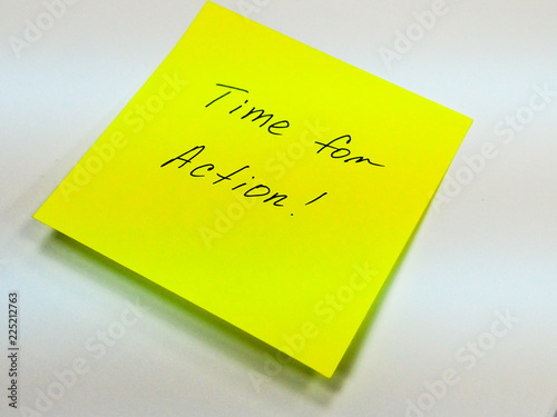 Sticky note with text time for action, motivation
