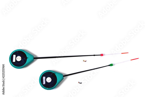 Fitted fishing rods for winter fishing on a white background, close-up