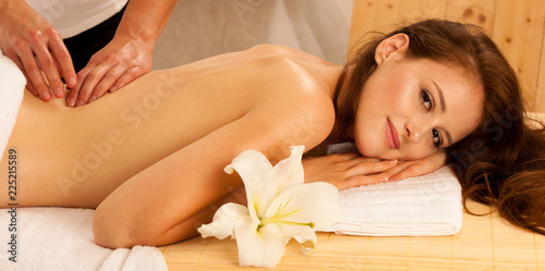 Body care. Spa body massage treatment. Woman having massage in the spa salon
