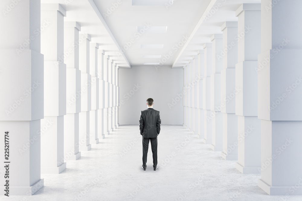 Businessman in modern corridor Businessman in modern corridor