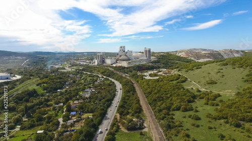 Verkhnebakansky cement plant, top view. Factory for the production and preparation of building cement. Cement industry.