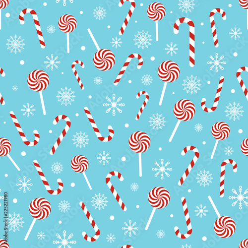 Christmas seamless pattern with candy canes, lollipops, snowflakes, snow ball on blue background. Design for wrapping paper, print, greeting cards. Winter Holiday concept. Vector illustration
