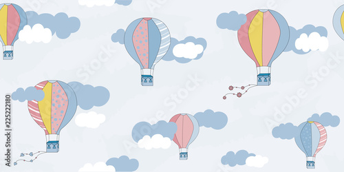 Vector seamless pattern with balloons and clouds. Children's pattern. Vector textile fabric print.